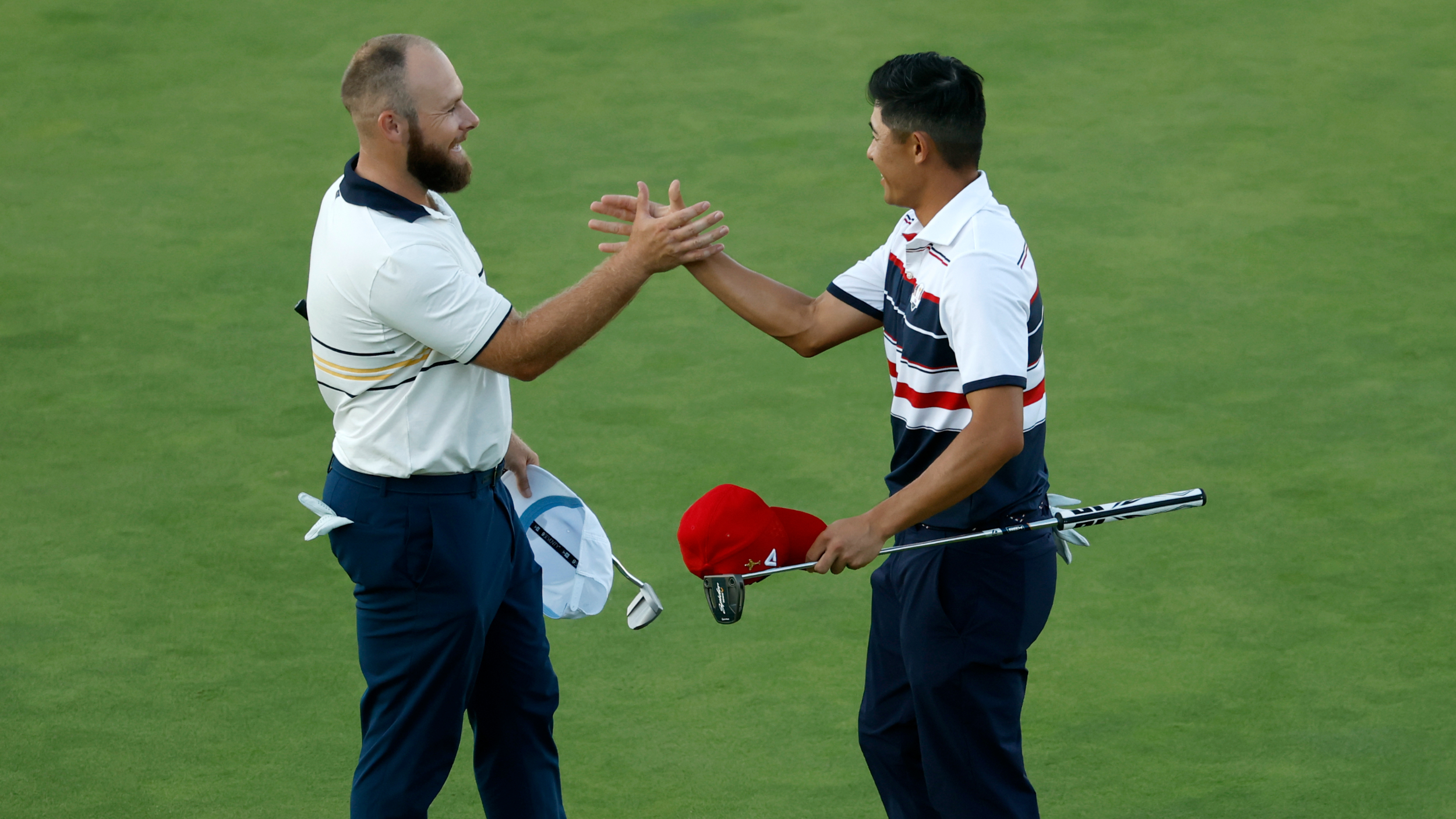 Tyrrell Hatton and Collin Morikawa after their Ryder Cup match