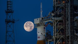 The Strawberry Supermoon rises above NASA's moon rocket, which sits prepared for tests at a launch pad at NASA Kennedy Space Center in Florida.