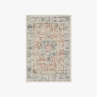 A red and blue persian style washable rug
