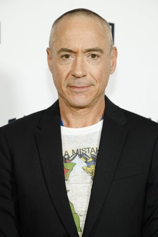 RDJ on the red carpet with a shaved head