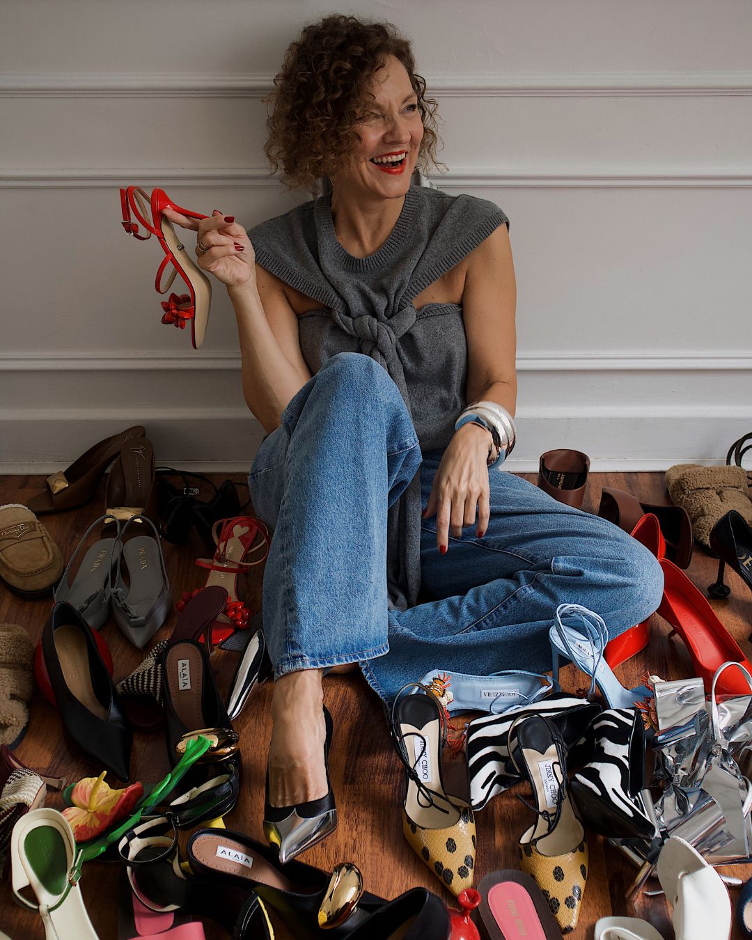renia jaz poses with her shoe collection