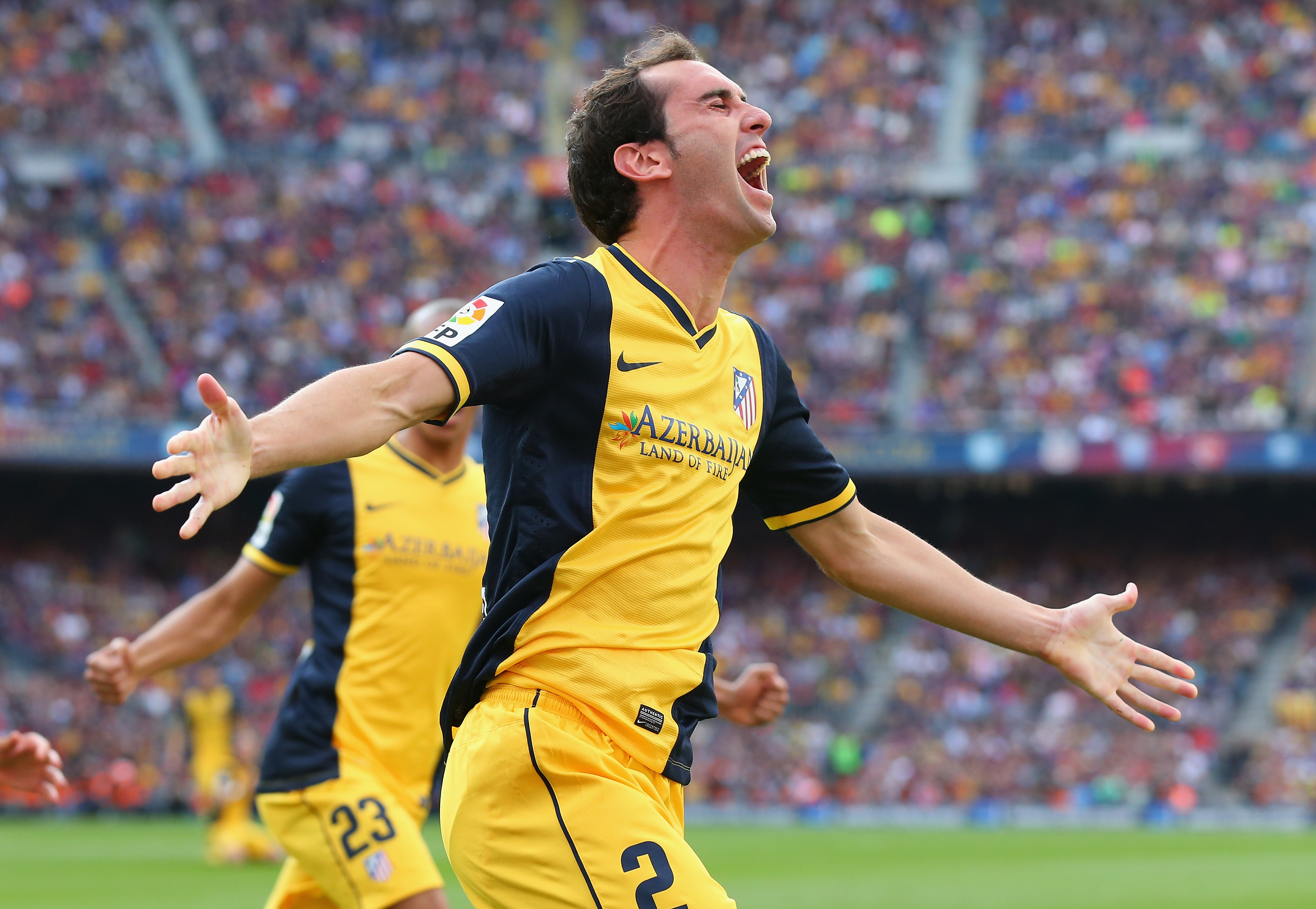 Diego Godin celebrates after scoring for Atletico Madrid against Barcelona in the teams' La Liga decider at Camp Nou in May 2014.