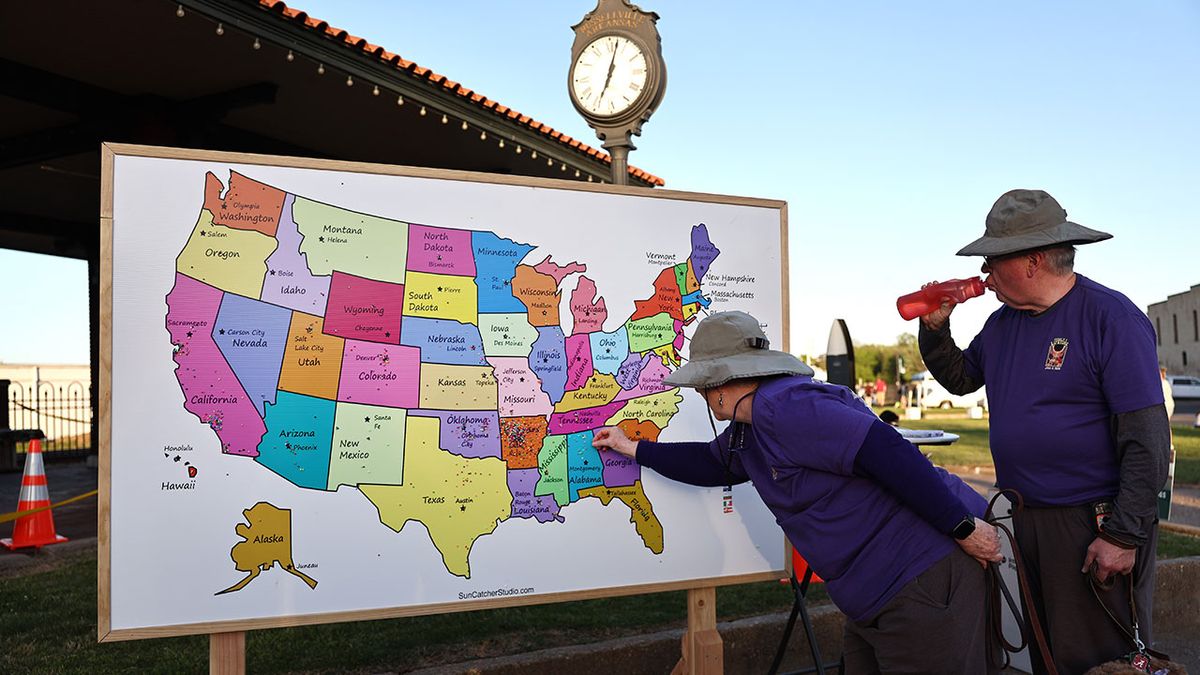 A visitor adds a pin to a map displaying where eclipse seekers are visiting from during the town&#039;s celebration of the April 8 solar eclipse on April 07, 2024 in Russellville, Arkansas. Communities across the country in the path of totality of the April 8 eclipse are holding festivals and preparing to host a massive influx of visitors to view the rare celestial phenomenon.