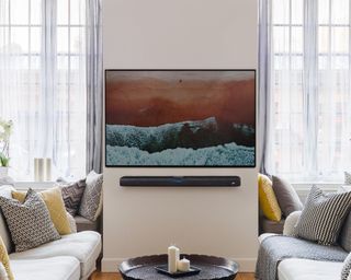 TV and soundbar mounted onto a wall