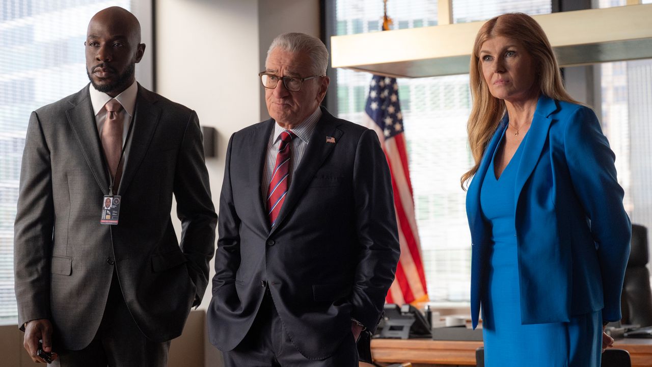 McKinley Belcher III as Carl Otieno, Robert De Niro as George Mullen and Connie Britton as Valerie Whitesell standing in an office in front of an american flag in zero day