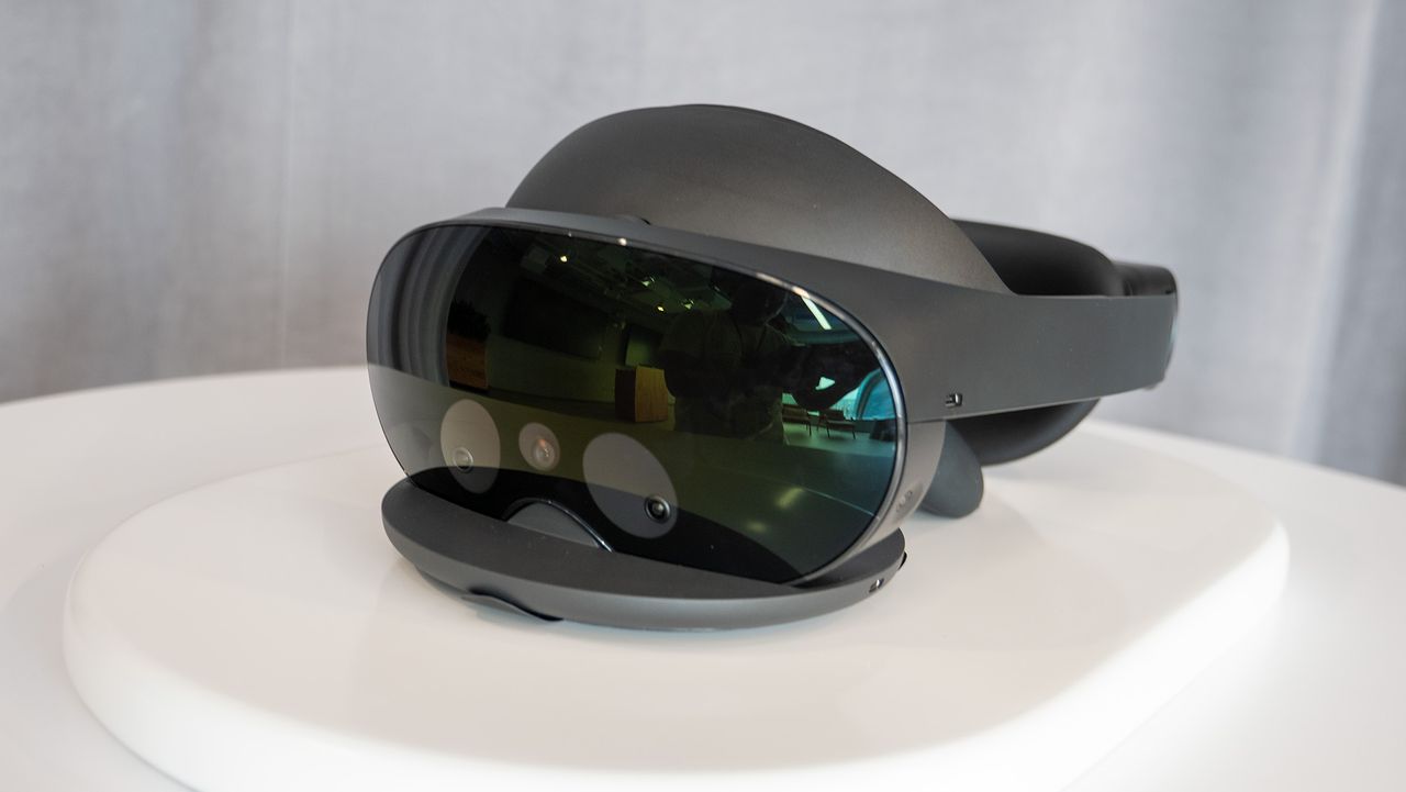 Meta Quest Pro headset with Quest Touch Pro controllers charging on the included dock