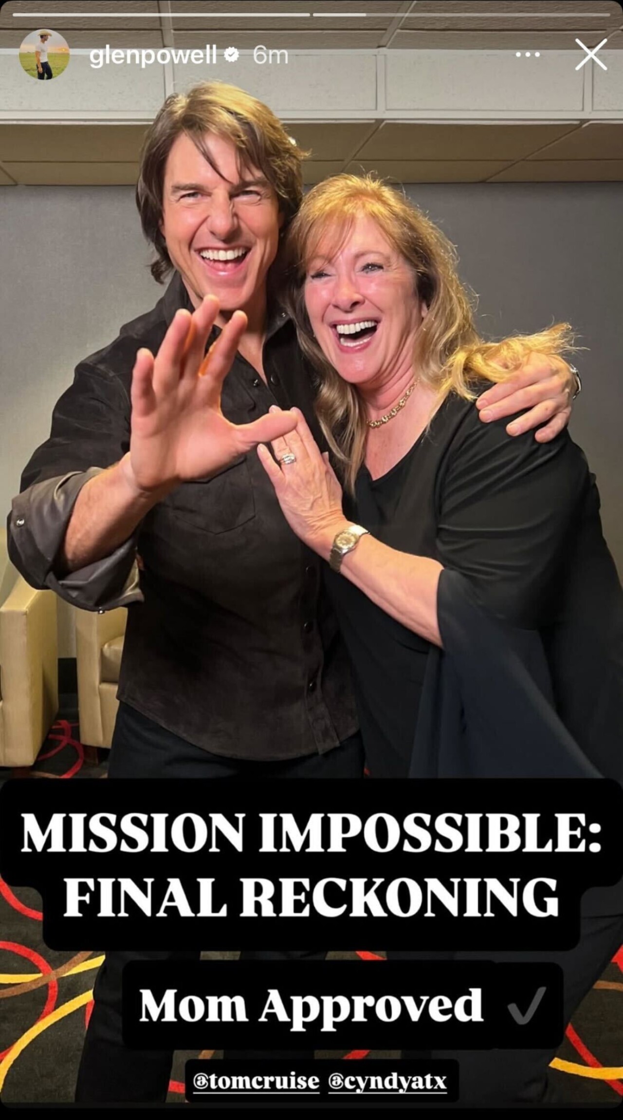 Tom Cruise and Glen Powell's mom smiling together with caption 