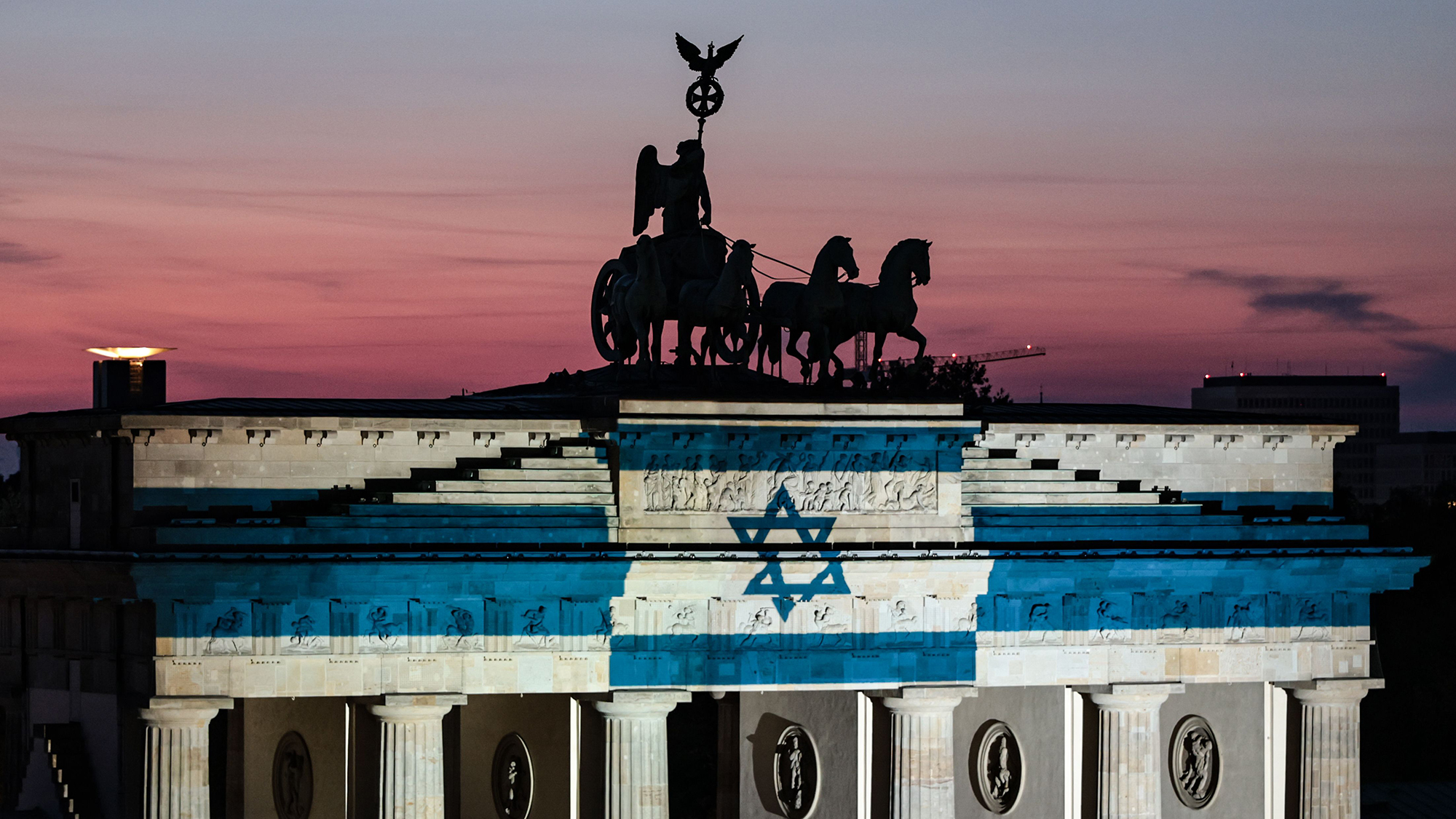 The Brandenburg Gate is illuminated with the Israeli national colors to mark the 3rd anniversary of the October 7 attacks against Israel, in Berlin, Germany
