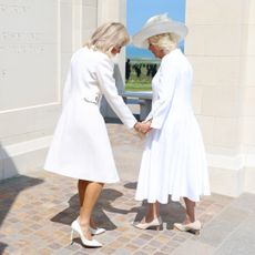 Brigitte Macron and Queen Camilla lay flowers during the UK Ministry of Defence and the Royal British Legion’s commemorative event at the British Normandy Memorial to mark the 80th anniversary of D-Day on June 06, 2024 in Ver-Sur-Mer, France.
