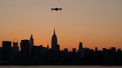 A drone hovers above the Hudson river, which lies between the New York City borough of Manhattan and Hoboken, New Jersey