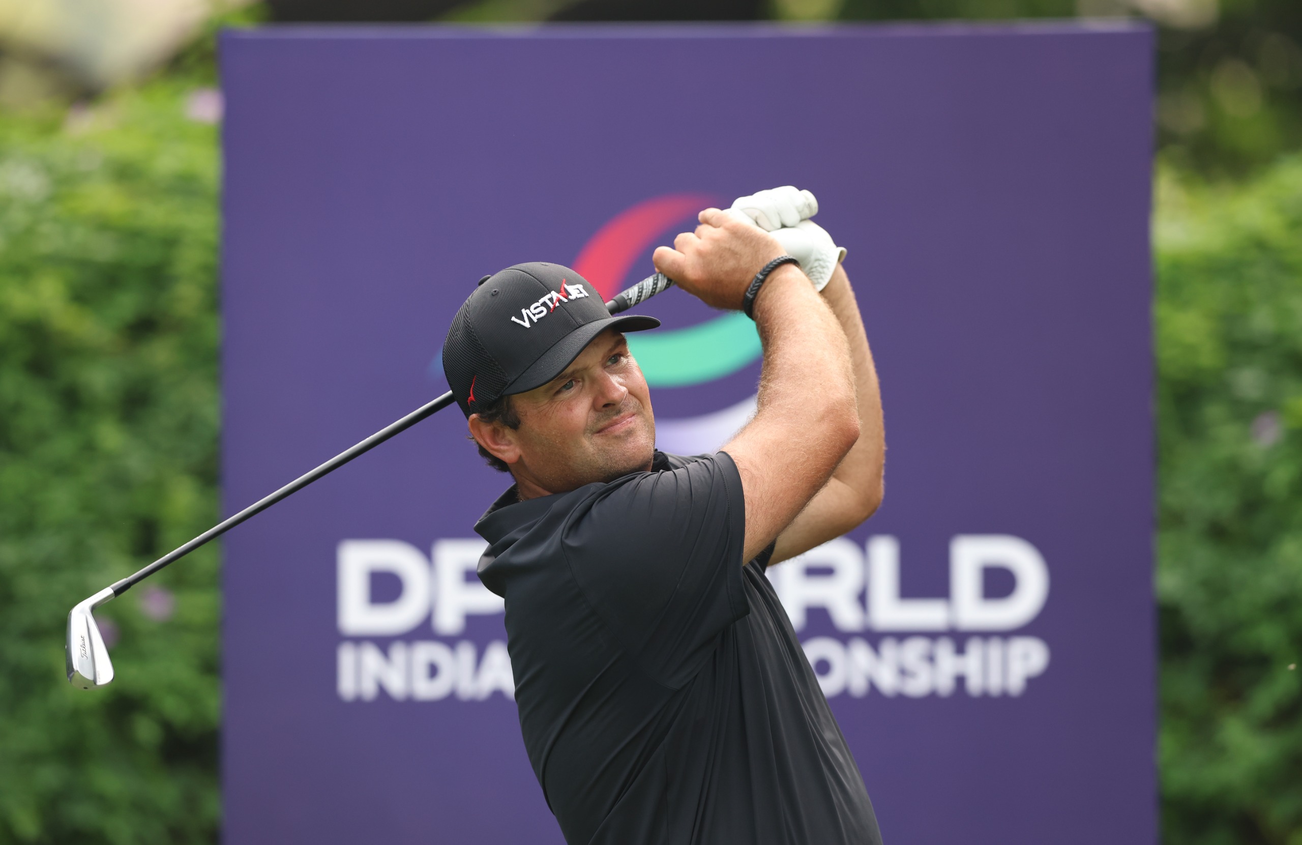 Patrick Reed holds his finish on a tee shot