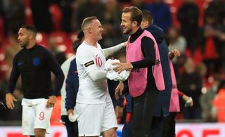 Wayne Rooney, left, celebrates with Harry Kane