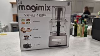 Magimix 4200XL Food Processor in its box on a white marble counter