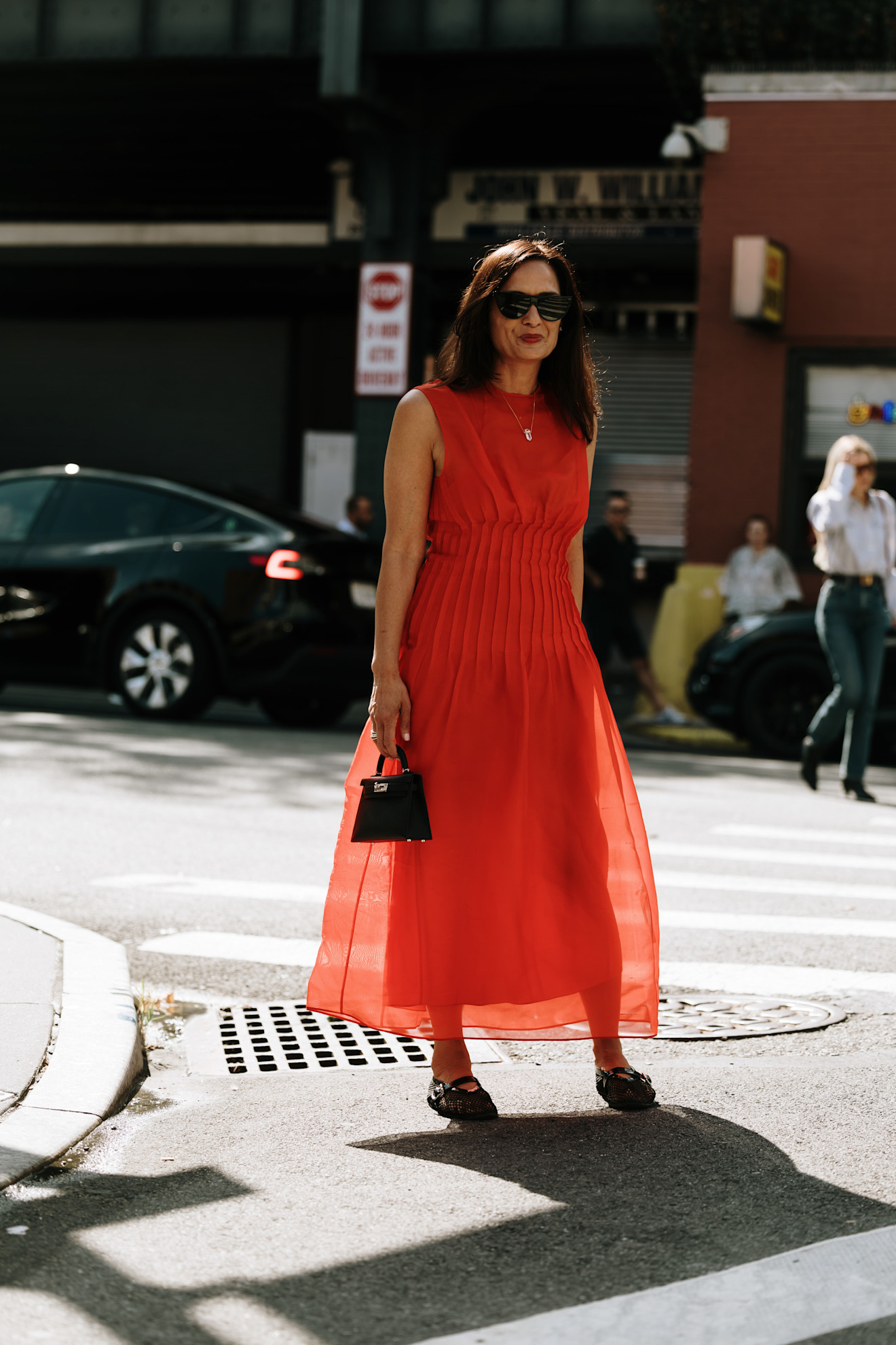 woman wearing orange dress and mary-jane flats