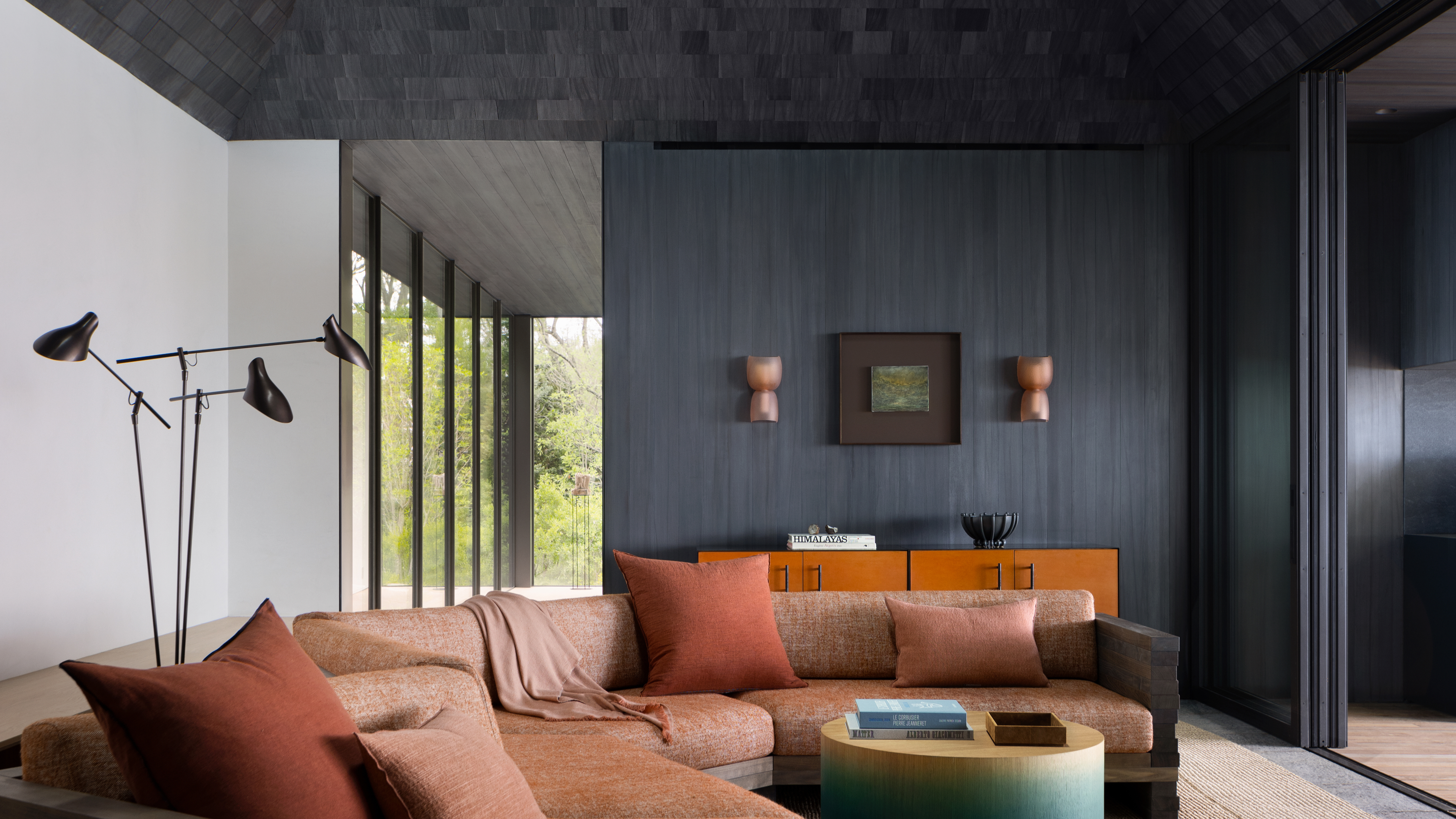 living room with corner sofa and plenty of lamps