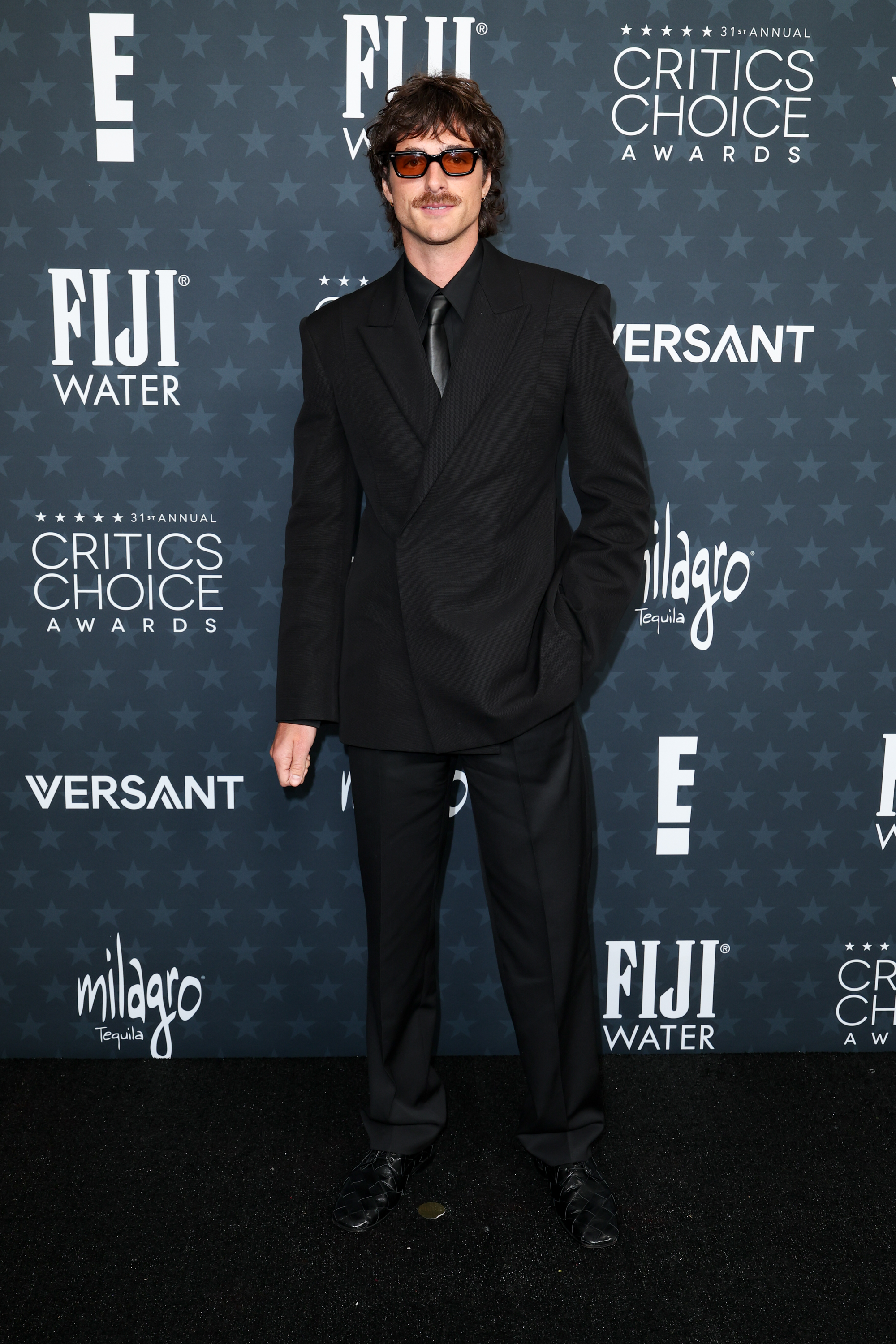 Jacob Elordi on the 2026 Critics Choice Awards red carpet wearing a black suit