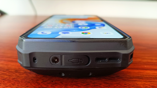 Ulefone Armor 29 Ultra phone on desk next to normal sized phone