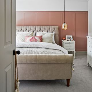 pink guest bedroom with panelling