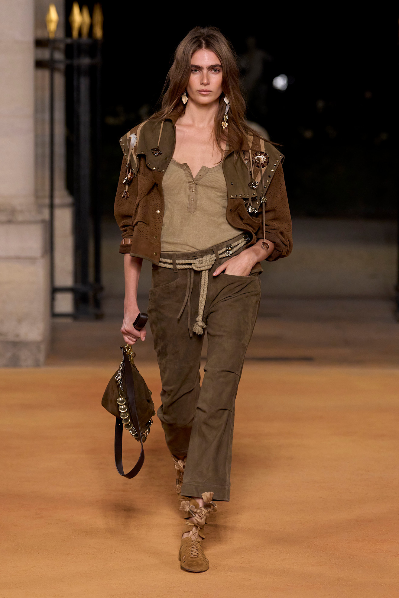 Marant S26 model wears khaki trousers, vest top and jacket