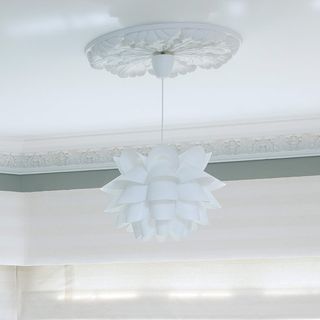 rose ceiling with ceiling lights and white wall