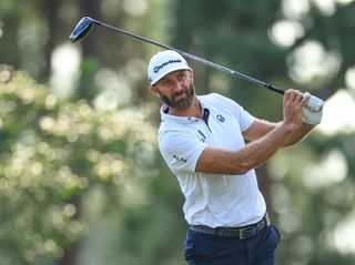 Dustin Johnson strikes a driver with his tee shot