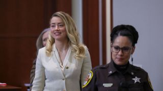 Amber Heard smiling in court.