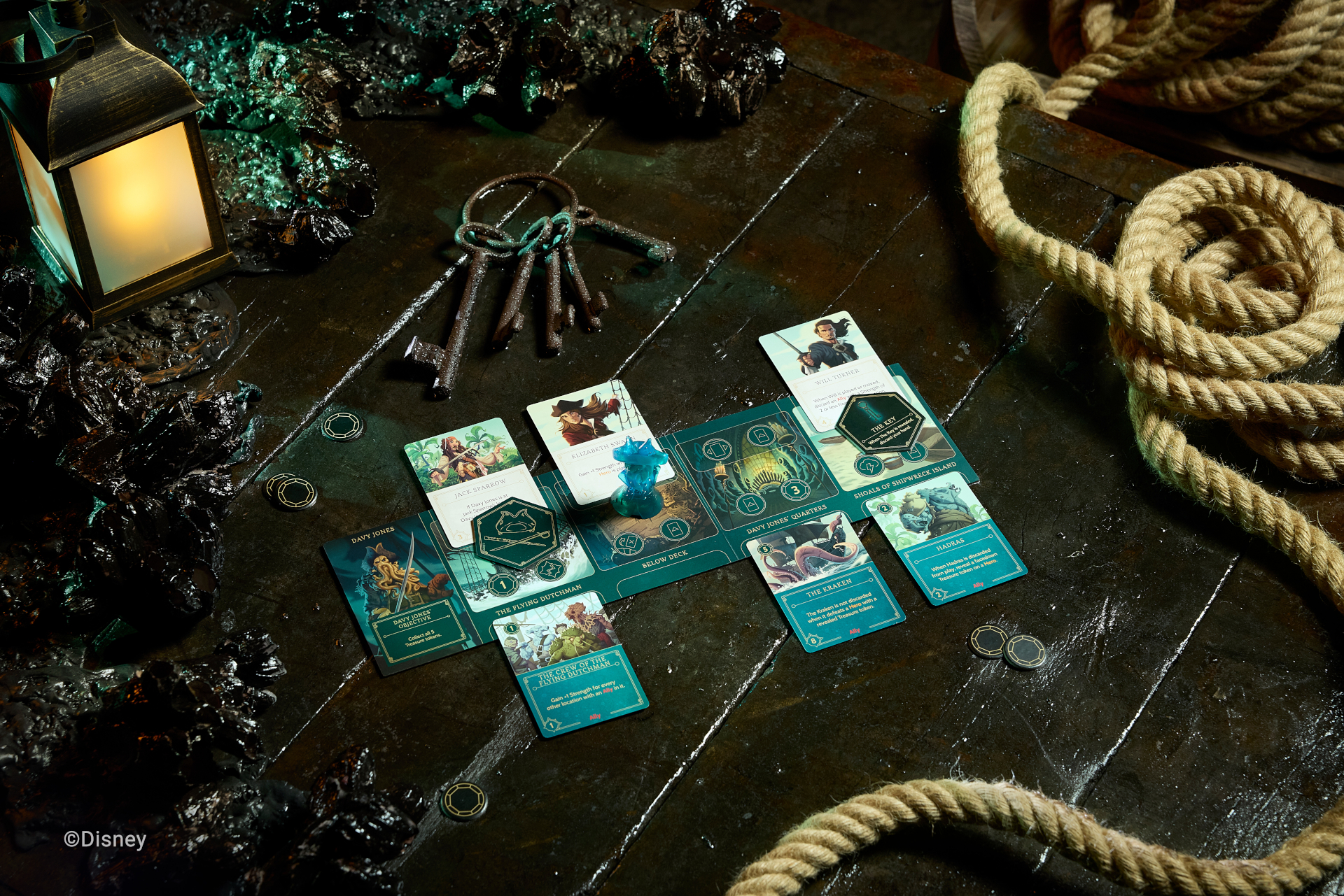 Disney Villainous: Treacherous Tides cards, tokens, and pieces on themed background with barnacles, lamp, keys, and rope