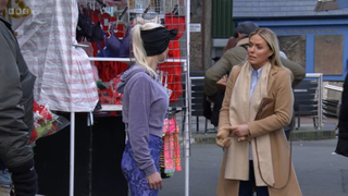 Lola Pearce-Brown and Emma Harding next to a market stall