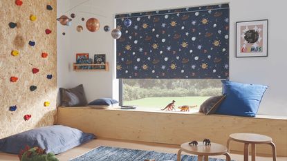 yellow couch with moon and stars on wall