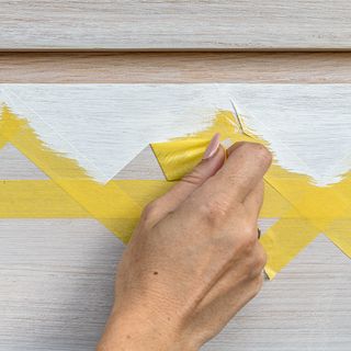 removing yellow tape from painted wooden table