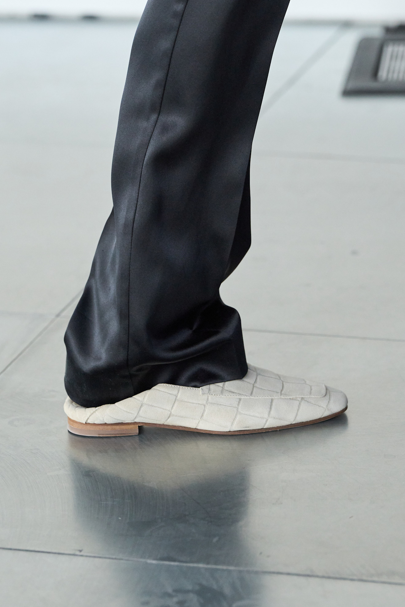 A model wore white loafers on the Tove Spring 2026 runway