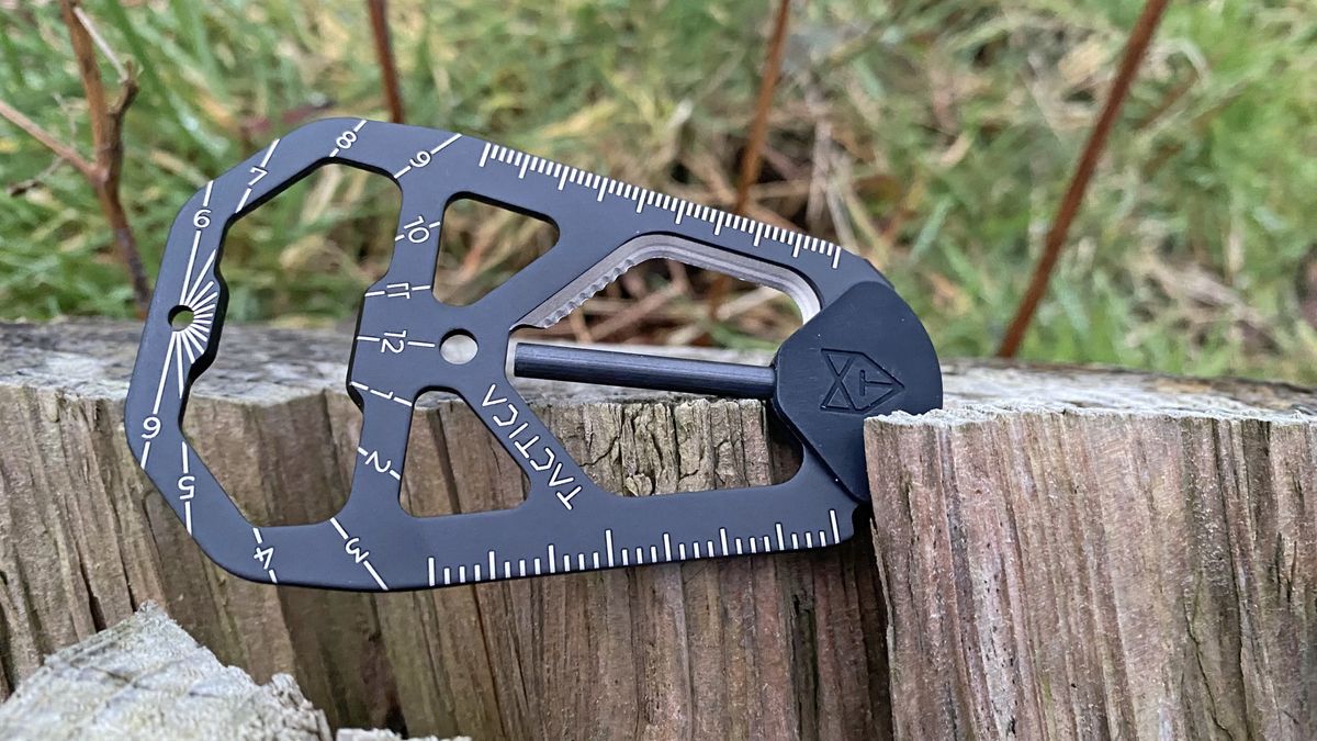 Tactica M.020 multitool on a tree stump