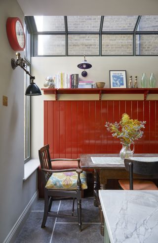 Red panelling in a dining room