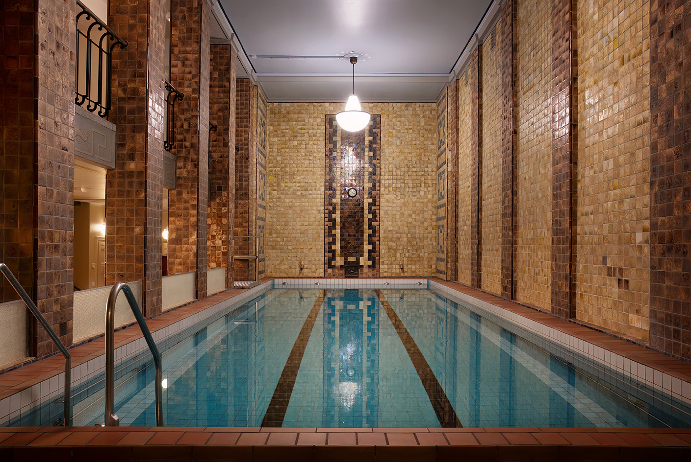 interior vista of Yrj&amp;ouml;nkatu, the indoors Helsinki swimming hall with its tall ceilings, art deco detailing and pool in the middle