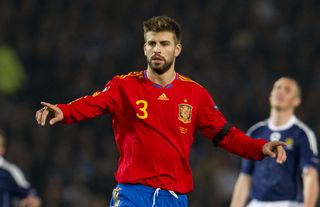 Gerard Pique in action for Spain against Scotland in 2010.