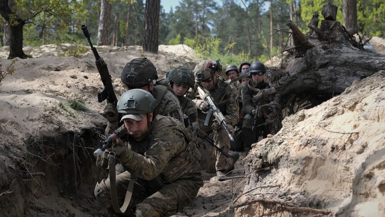 Ukraine soldiers take part in military exercises outside Kyiv on 3 May 