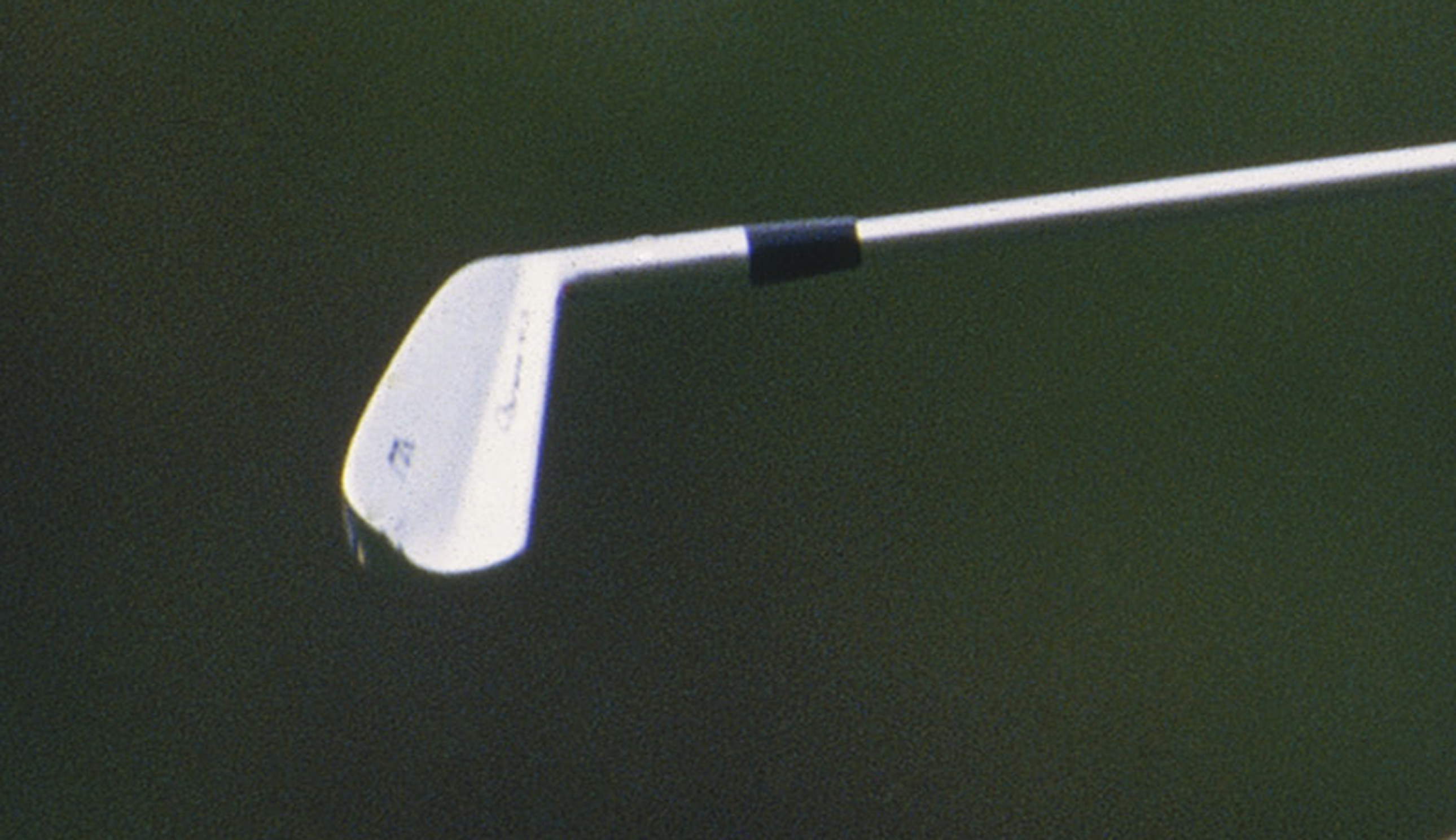 A close-up of Tiger Woods' irons