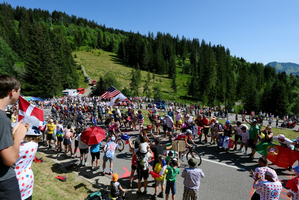 SAINTGERVAIS MONTBLANC FRANCE JULY 16 LR Wout Van Aert of Belgium and Team JumboVisma Rigoberto Uran of Colombia and Team EF EducationEasyPost Giulio Ciccone of Italy Mattias Skjelmose Jensen of Denmark and Team LidlTrek and a general view of the breakaway climbing to the Col de la Croix Fry 1463m while fans cheer during the stage fifteen of the 110th Tour de France 2023 a 179km stage from Les Gets les Portes du Soleil to SaintGervais MontBlanc 1379m UCIWT on July 16 2023 in SaintGervais MontBlanc France Photo by David RamosGetty Images