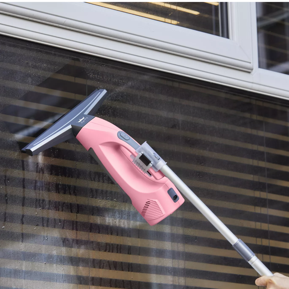 Swan x Lynsey SC59010QOC Rechargeable Cordless Window Vacuum Cleaner, one of the best window vacs, on extension pole on a window