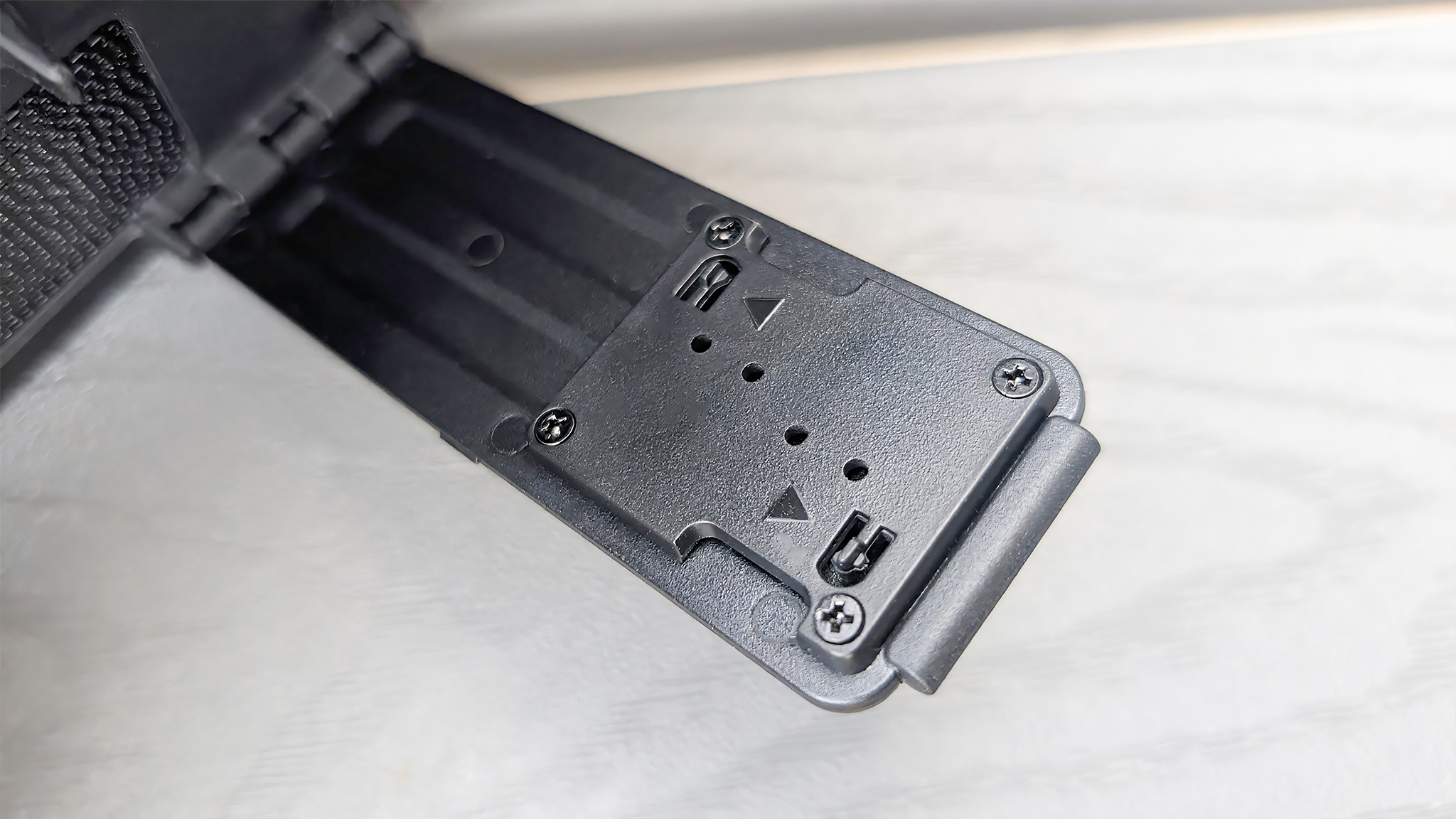 A closeup of the kickstand's microsD storage slots on the dBrand Killswitch.