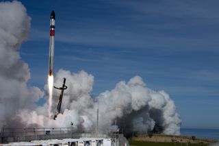 A Rocket Lab Electron booster launches 34 satellites to orbit on the "There And Back Again" mission on May 2, 2022.