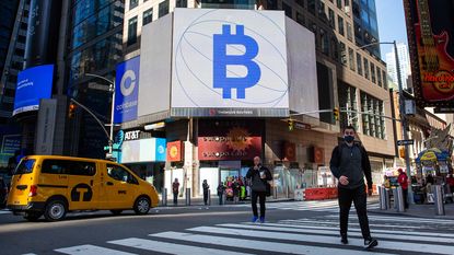Bitcoin symbol and the Nasdaq stock exchange