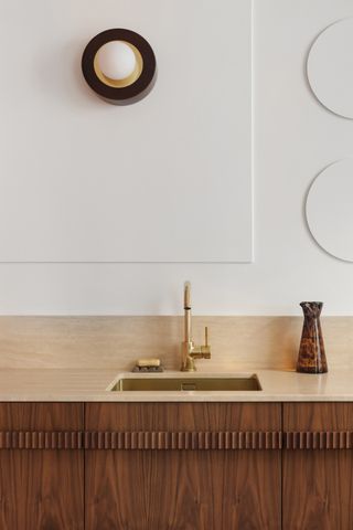 A kitchen with a taupe countertop