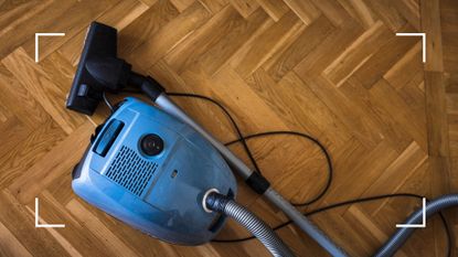 picture of vacuum on wooden parquet flooring