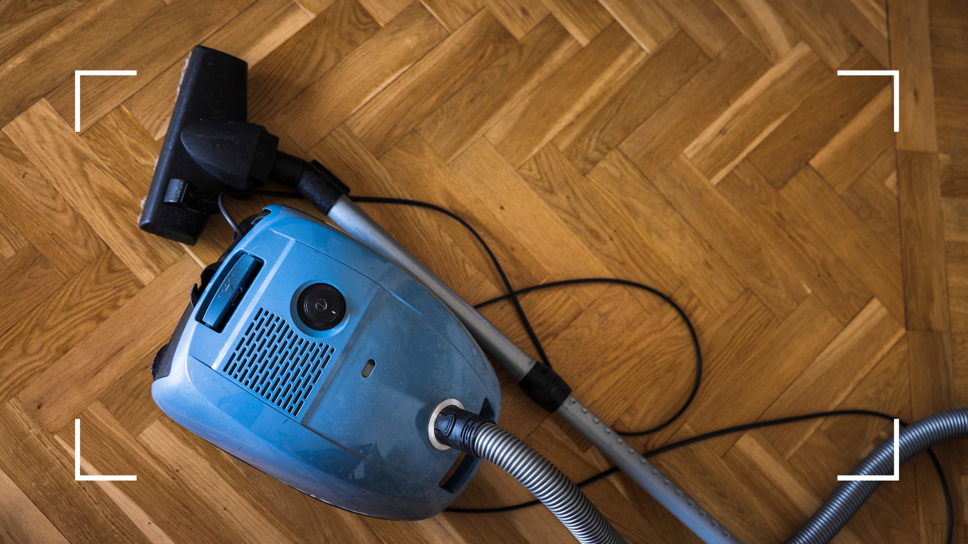 picture of vacuum on wooden parquet flooring