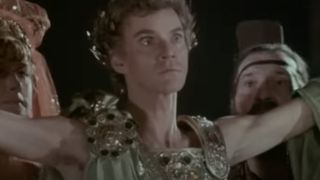 Caligula (Malcolm McDowell) presenting himself in Caligula