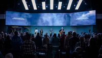 A church auditorium amps up for musical performances. 