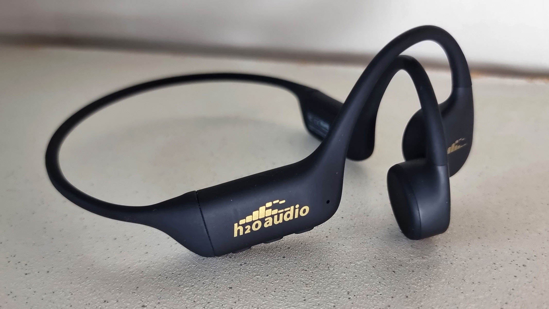a close-up picture of the H20 Audio Tri 2 Pro bone conduction headphones