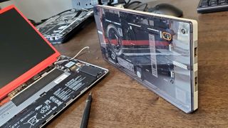 Framework AMD mainboard running in a Cooler Master chassis, with SteamOS on it