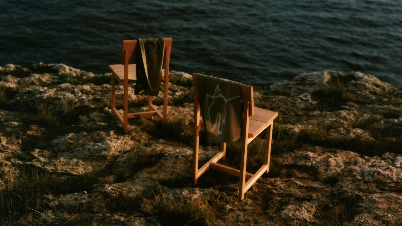 Wooden chairs at the top of a cliff